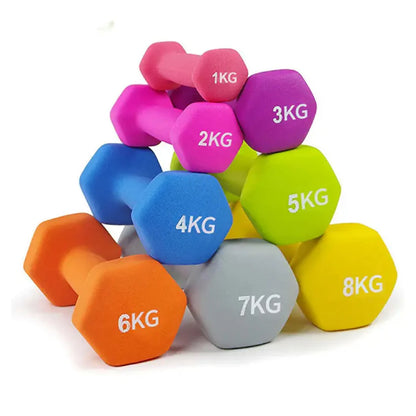Colorful dumbbells with weight markings on a white background
