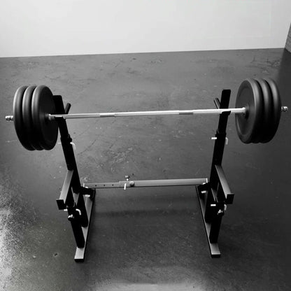 Barbell with weights on a weightlifting platform against a plain background