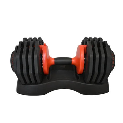 Black and orange adjustable dumbbell on a white background