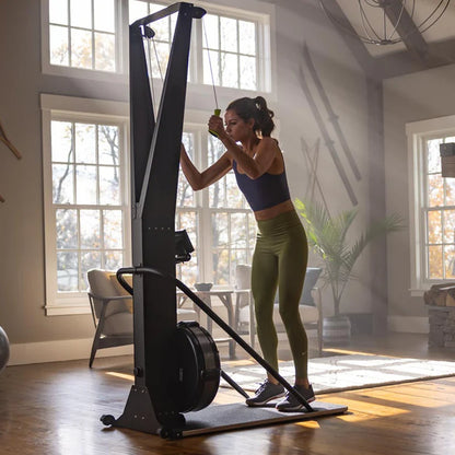 Woman exercising on a stationary bike in a home setting